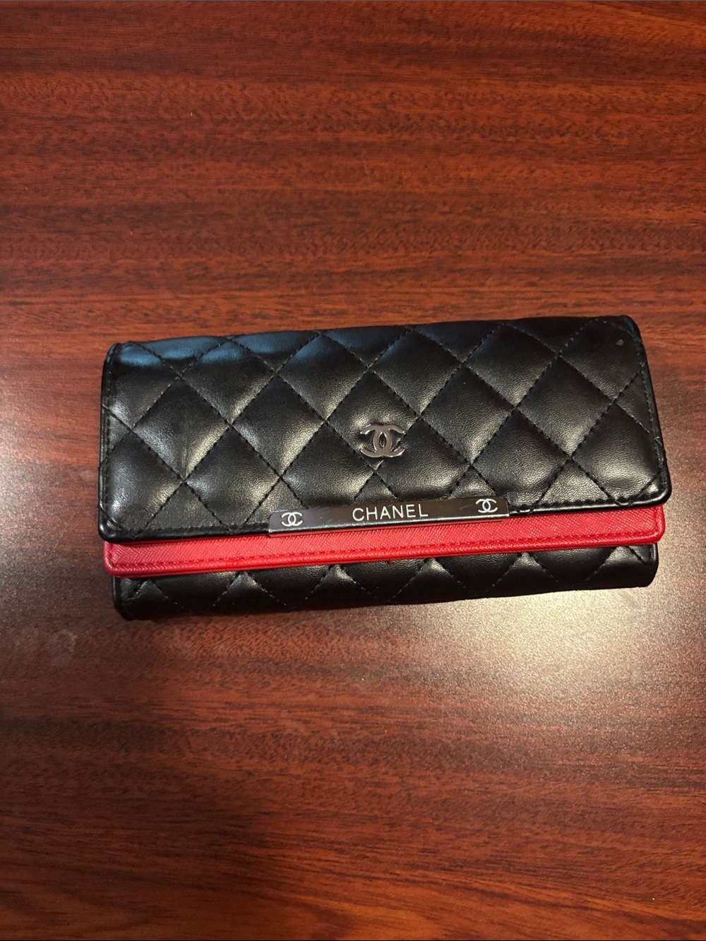 CHANEL Black Quilted Leather Wallet with Red Trim